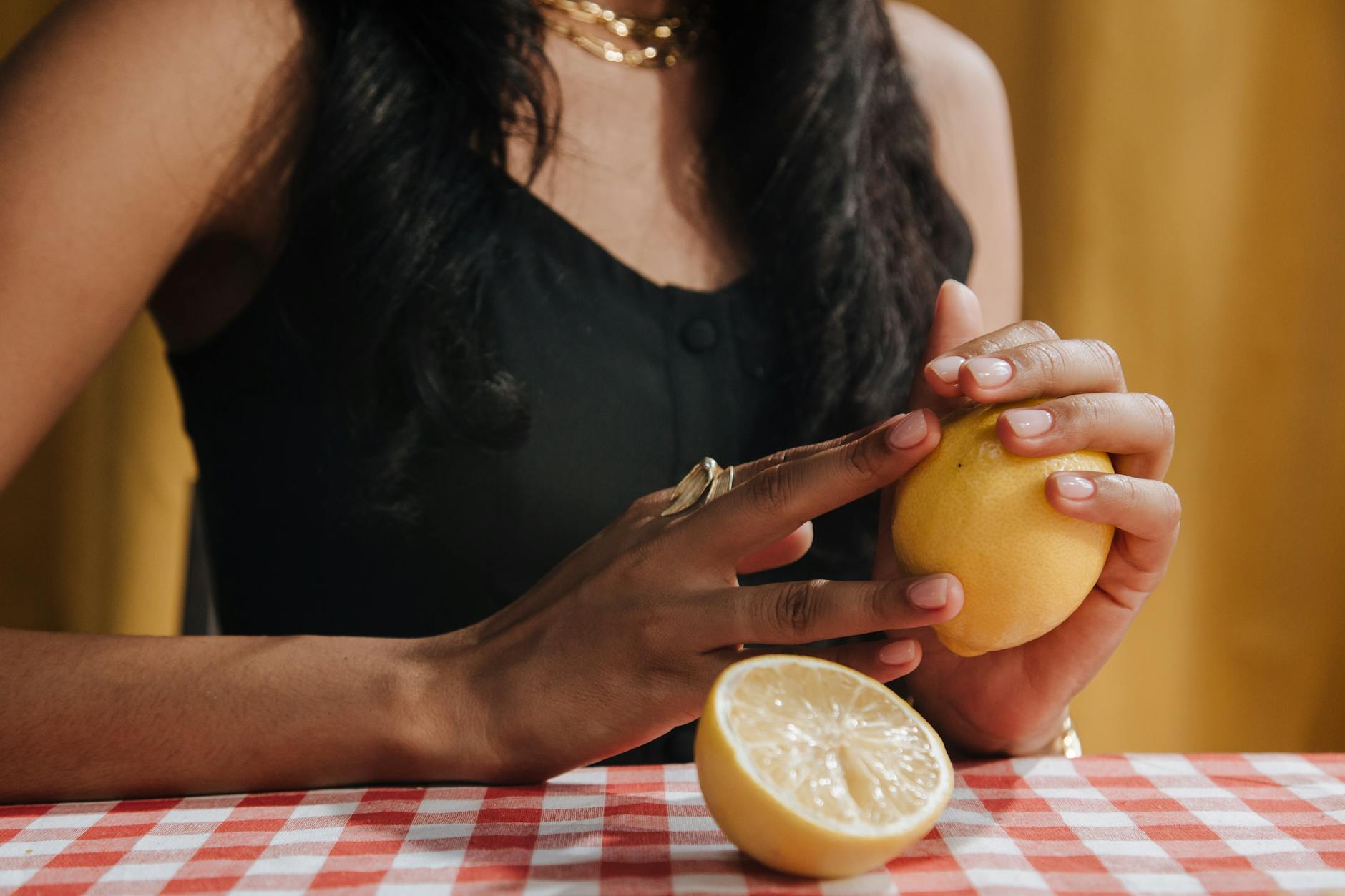 Woman holding colorful silicone vibrators, comparing texture and design options.